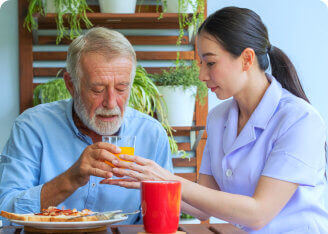 caregiver serving senior man his meal